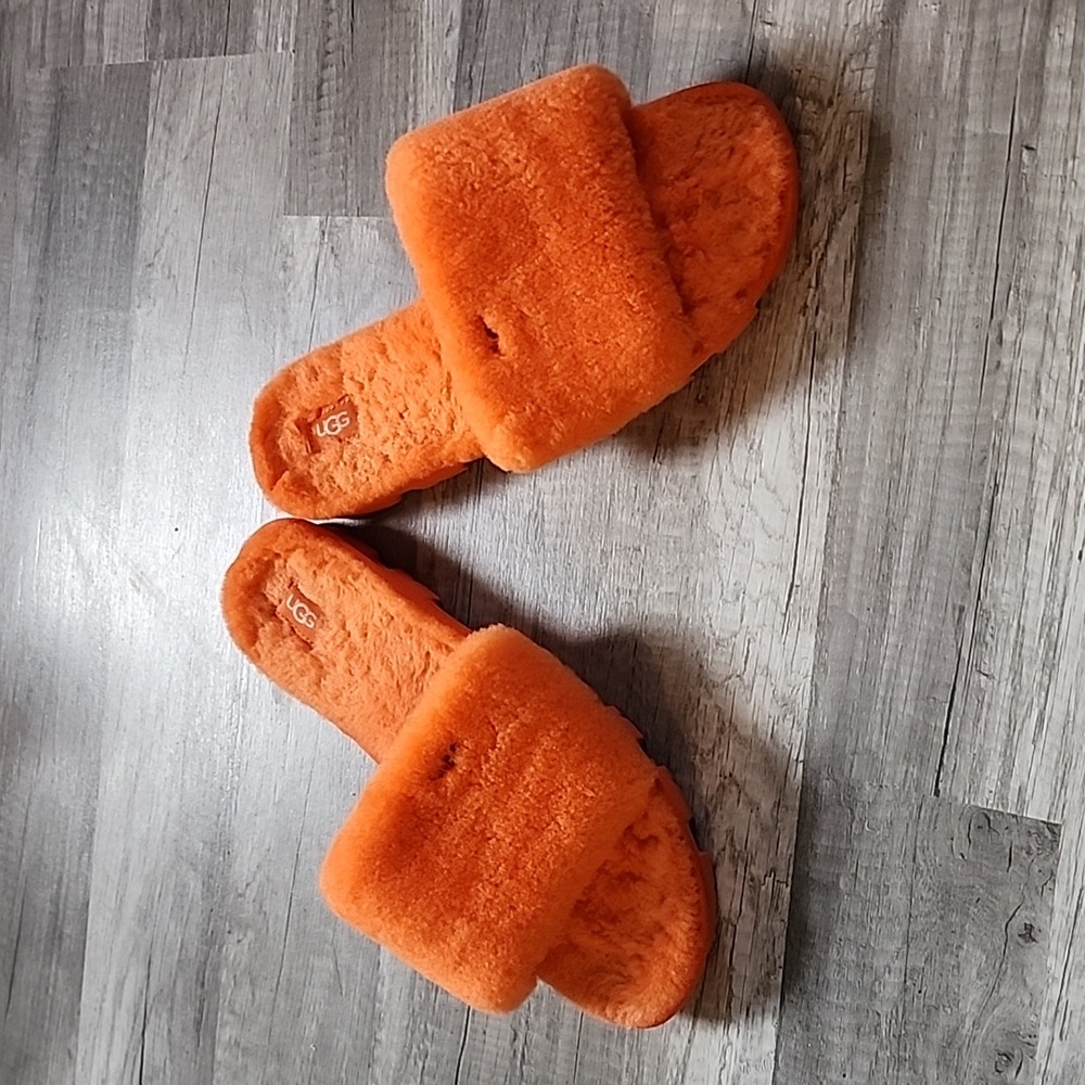 Orange fuzzy UGG slippers